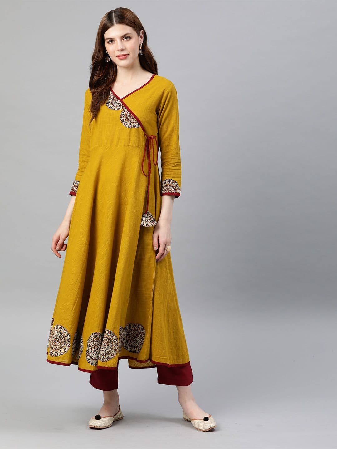 KALINI Women Mustard Yellow Floral Printed Angrakha Anarkali Kurta with Tassel Tie-Up - view 1