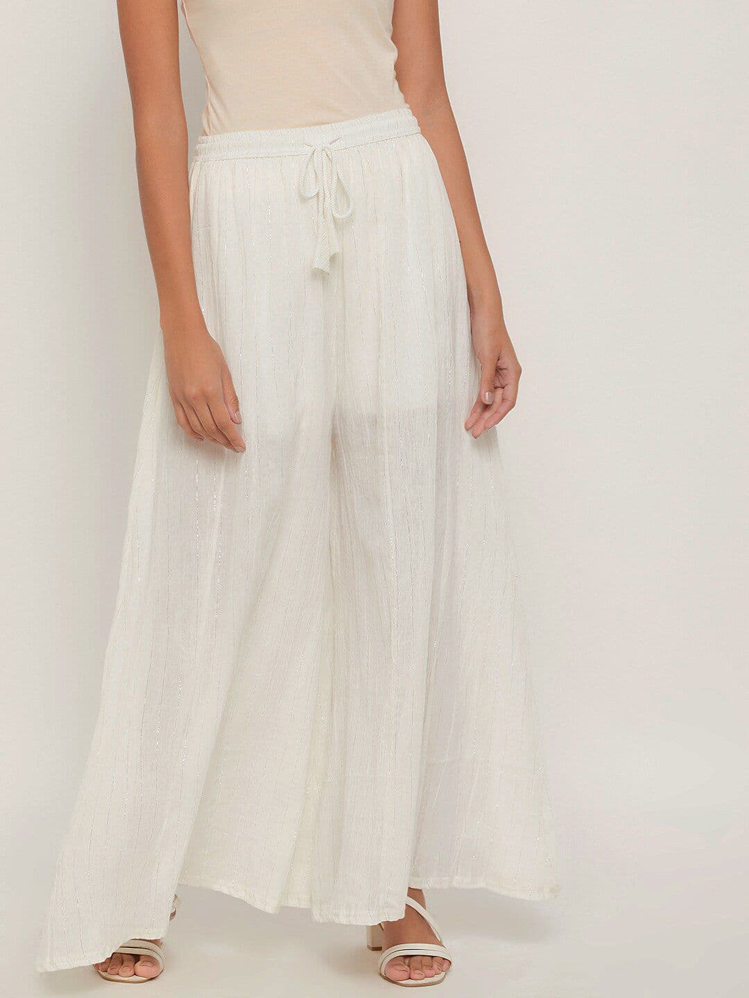 Clora Creation Women White Embellished Flared Ethnic Palazzo - view 1