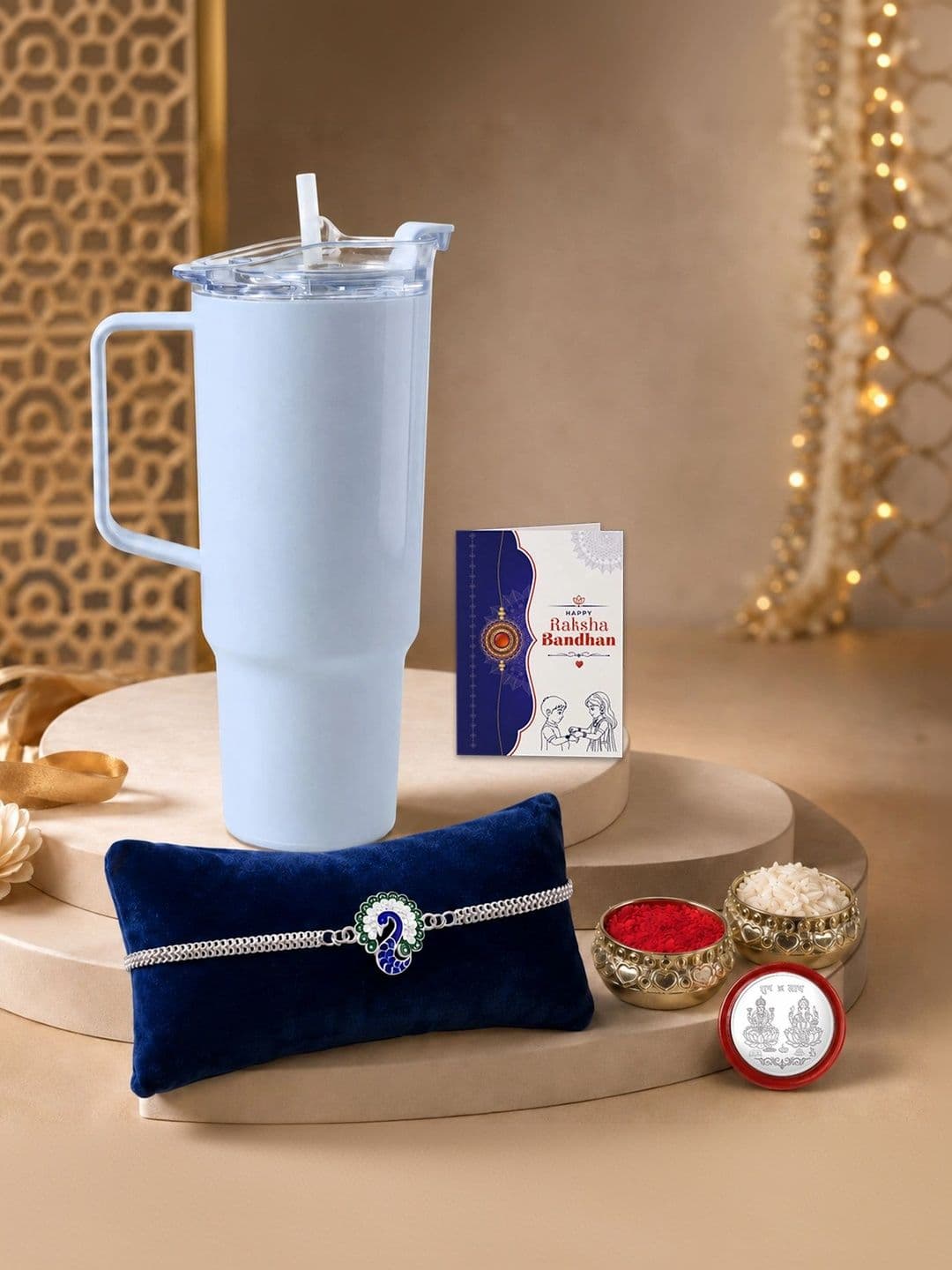 Myntra Elegant Homes Rakhi With Tumbler Silver Coin & Roli Chawal - view 1