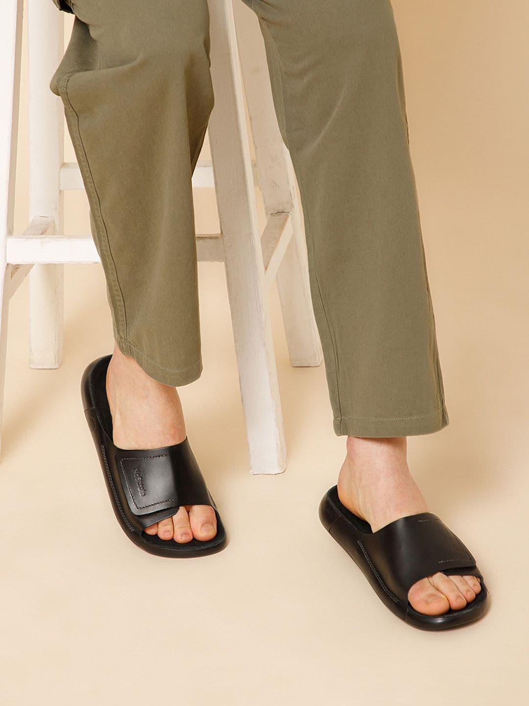 NoStrain Broad Strap Leather Sliders for men in Jet Black color. - view 1