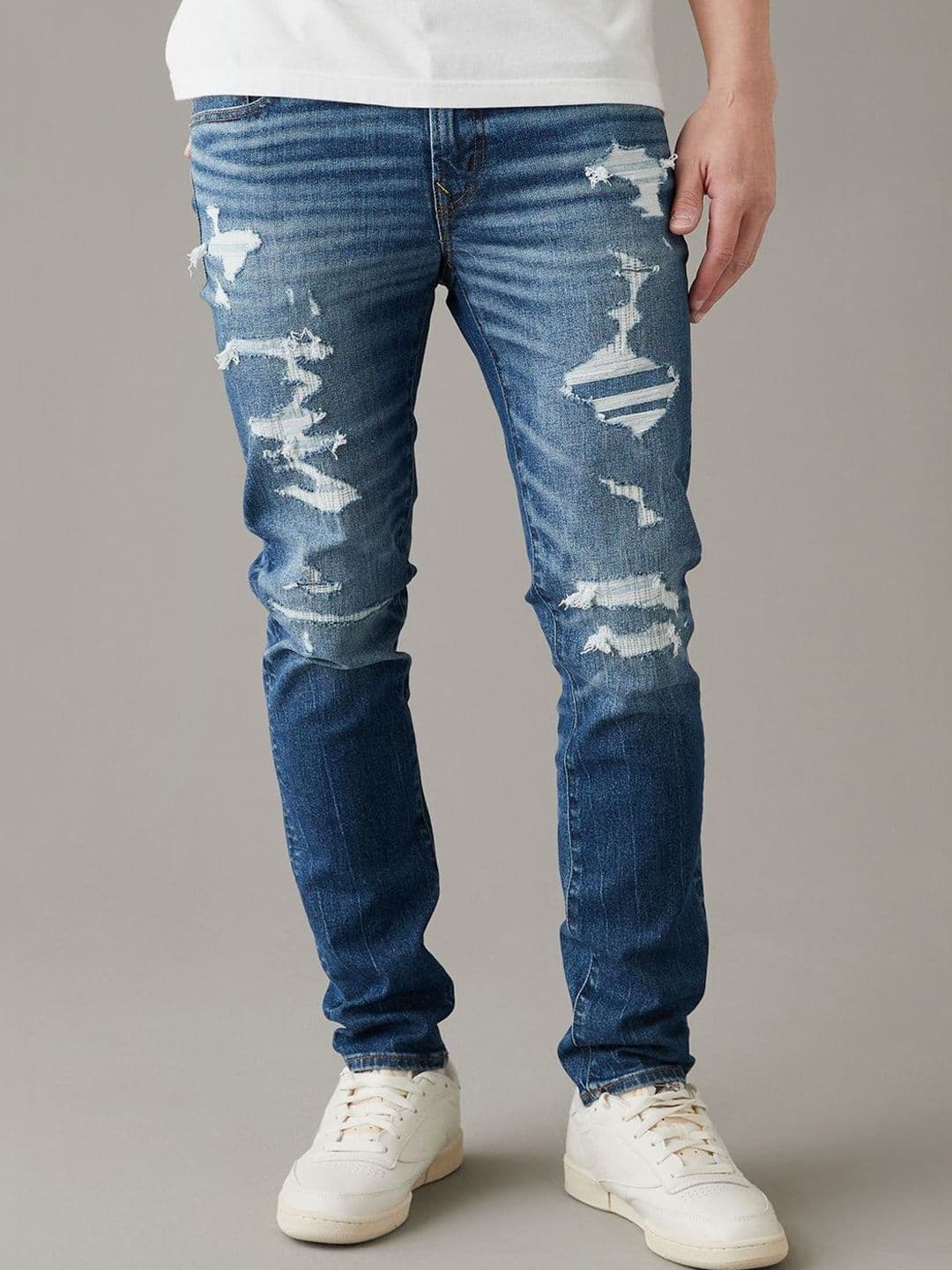 AMERICAN EAGLE OUTFITTERS American Eagle Men Blue AirFlex+ Patched Skinny Jeans - view 1
