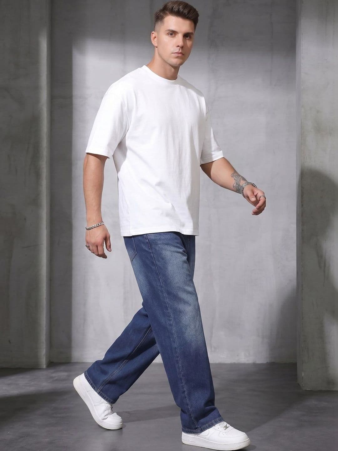 StyleCast Men Comfort Mid-Rise Low Distress Light Fade Jeans - view 1