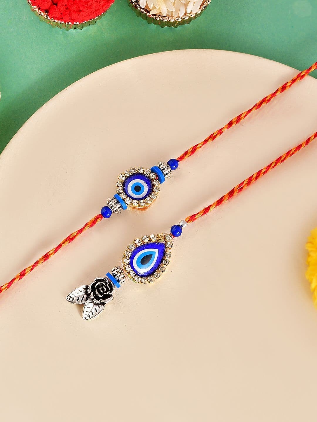 Sangria Set Of 2 Evil Eye Floral Charm Bhaiya Bhabhi Rakhi & Roli Rice with Greeting Card - view 1